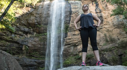 Employee hiking in her free time has reached a waterfall.