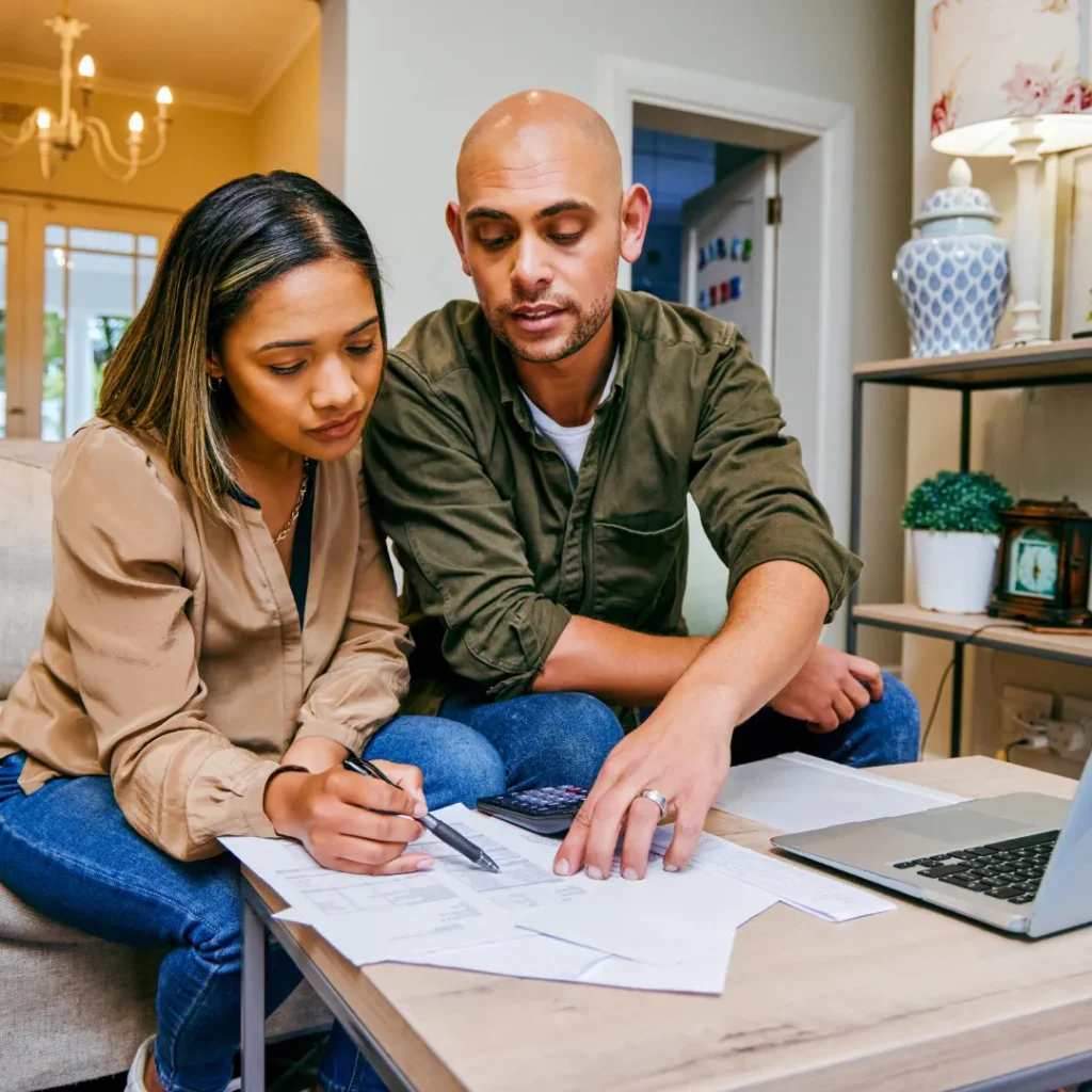 man and woman discussing loan paperwork